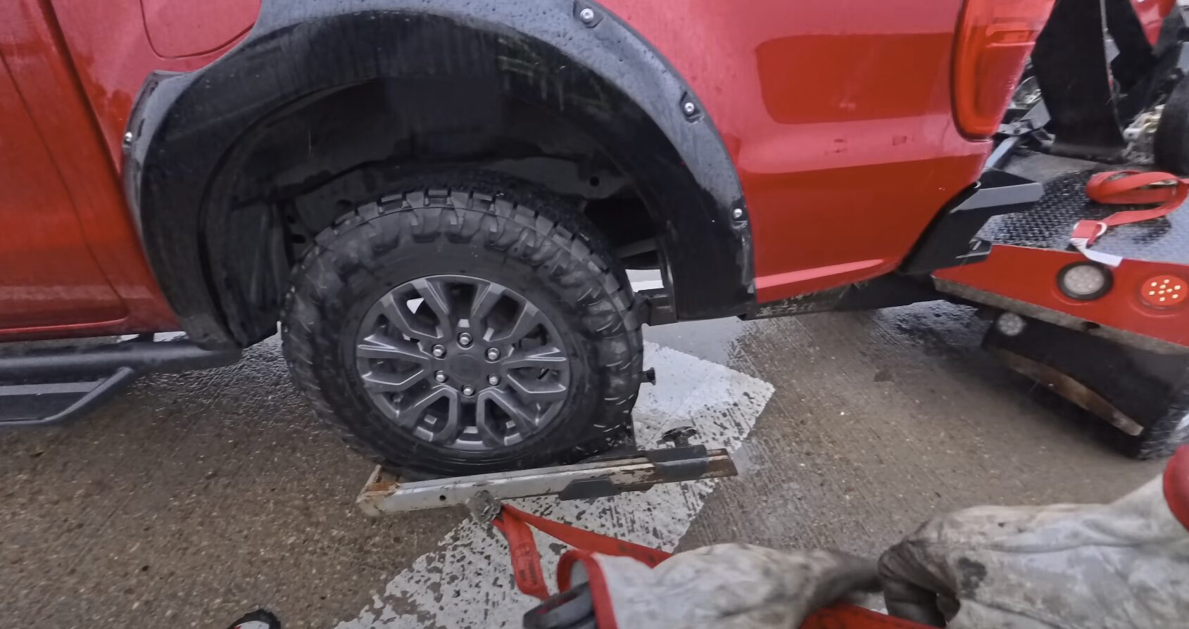Professional towing equipment securing vehicle for safe transport