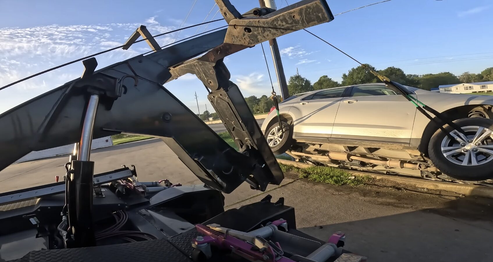 Professional tow truck operator loading vehicle in La Habra, CA
